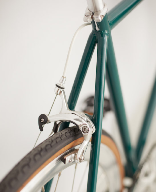 a classic green bicycle for getting around your neighborhood